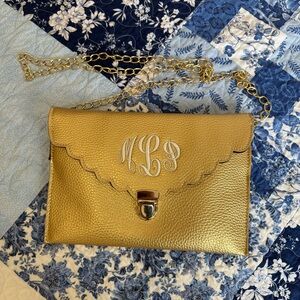 United Monograms Gold clutch & crossbody with scalloped edges and MLP monogram
